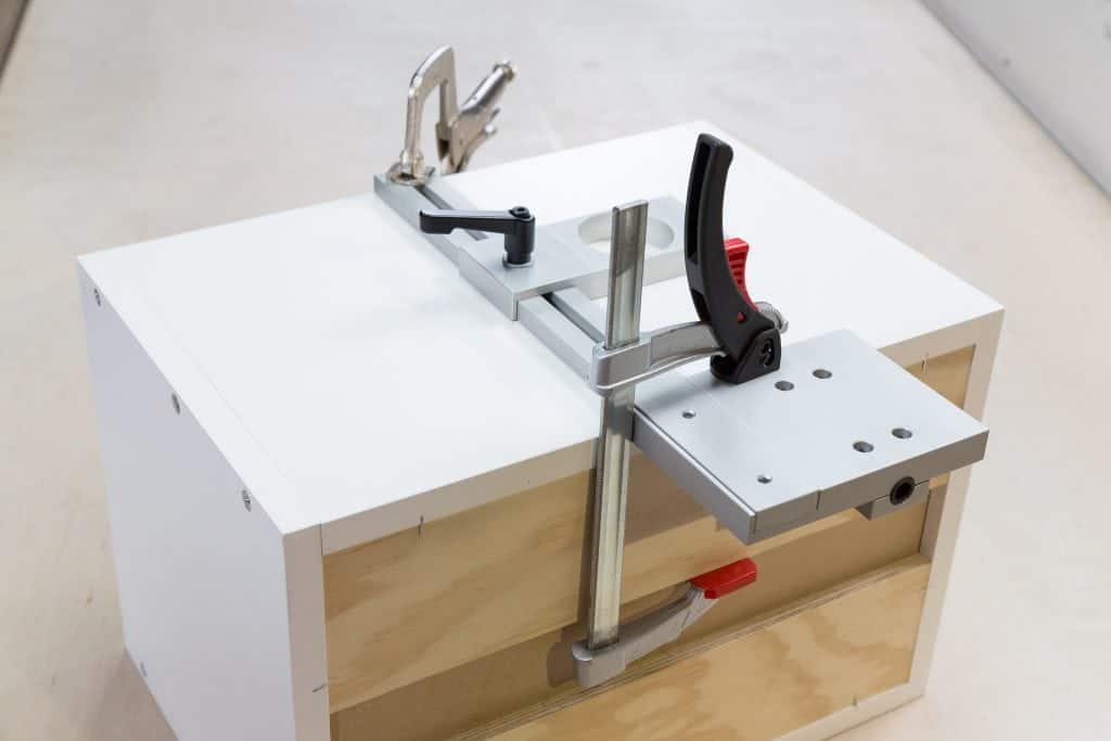 TP-PLJ Puck Light Jig clamped on cabinet