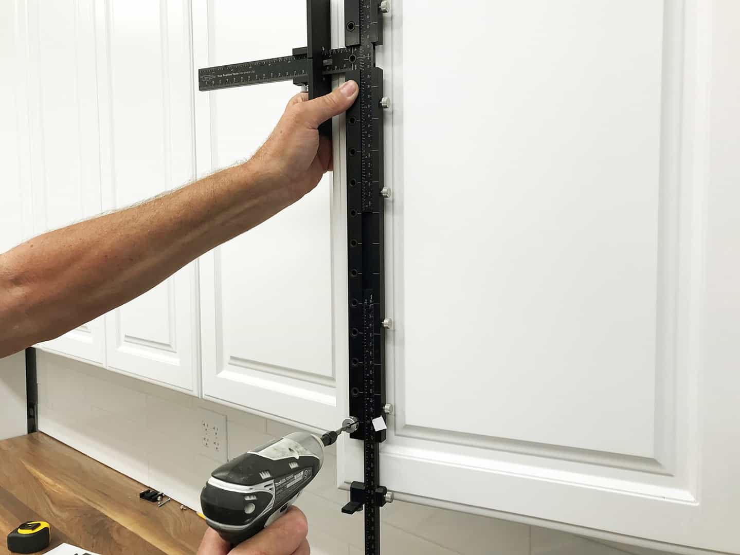 long handle installation on tall cabinet doors with TP-1935 Cabinet Hardware Jig (step 10)