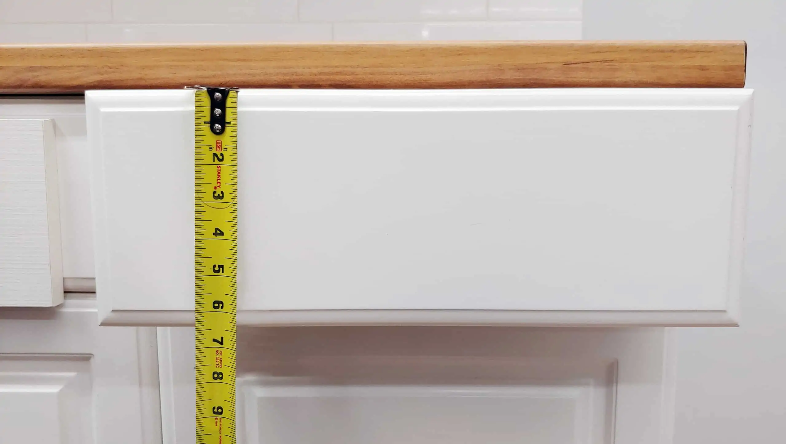 tape measuring height on cabinet drawer front