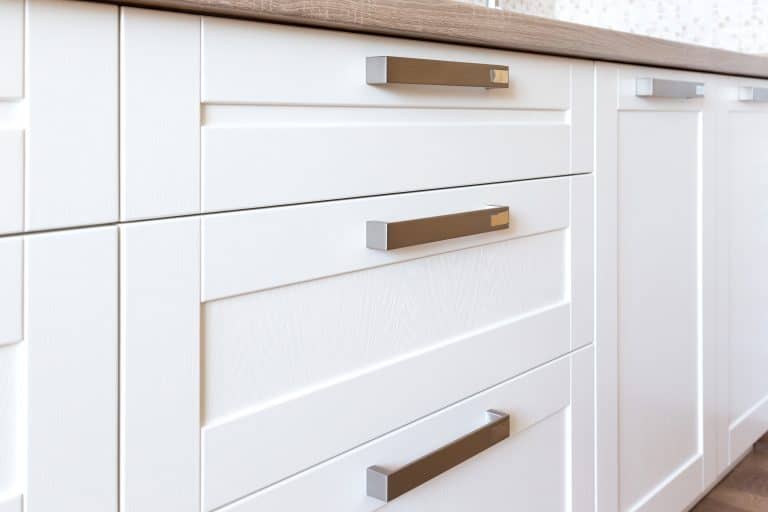 white shaker style modern kitchen cabinet drawers top rail handle placement