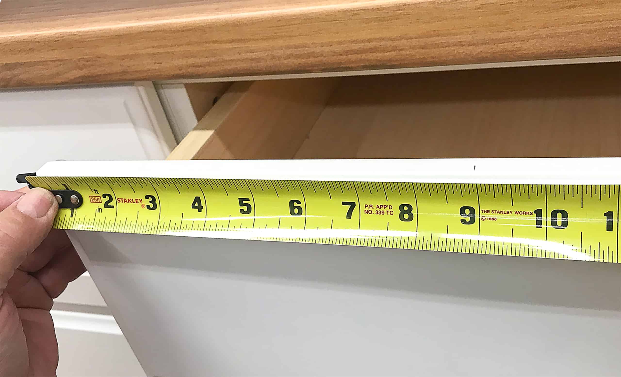 Tape Measure on cabinet drawer front