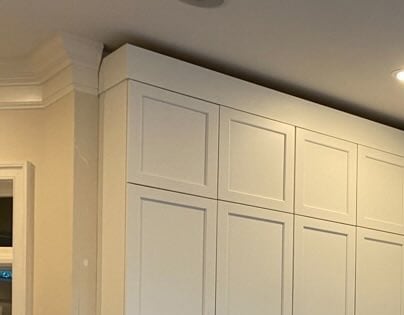 Leave space for crown molding installation.