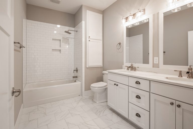 Vanity aligns with wall of bathroom.